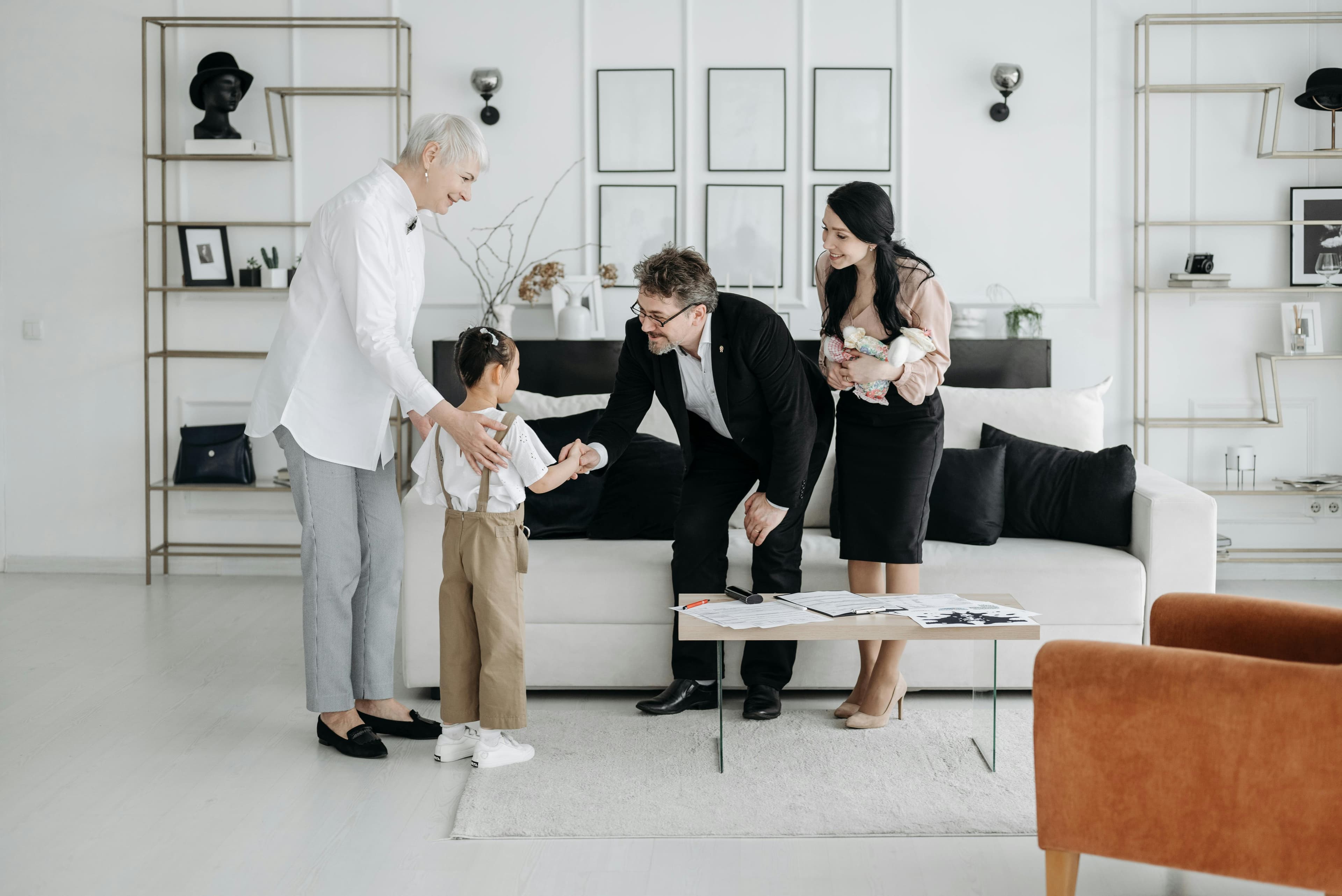 A multi-generational family gathered in a living room
